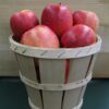 Wooden bushel basket filled with red apples
