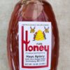 Clear plastic squeeze bottle of wildflower honey