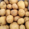 Box of fresh brown potatoes