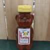 Bear-shaped honey bottle with yellow cap