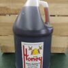 Gallon jug of unprocessed wildflower honey