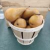 Wooden basket of ripe brown pears