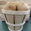 Small wooden basket filled with potatoes