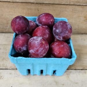 20260626_155814 Blue basket of ripe red plums