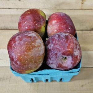 Basket of fresh red apples on wooden surface. Basket of fresh red apples on wooden surface.